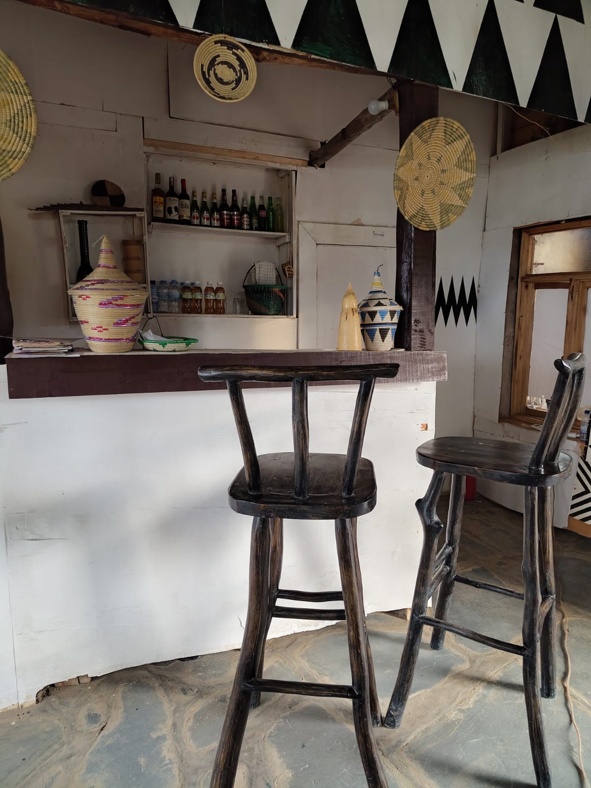 a group of tourists enjoying an outdoor
              meal in the rwandan countryside