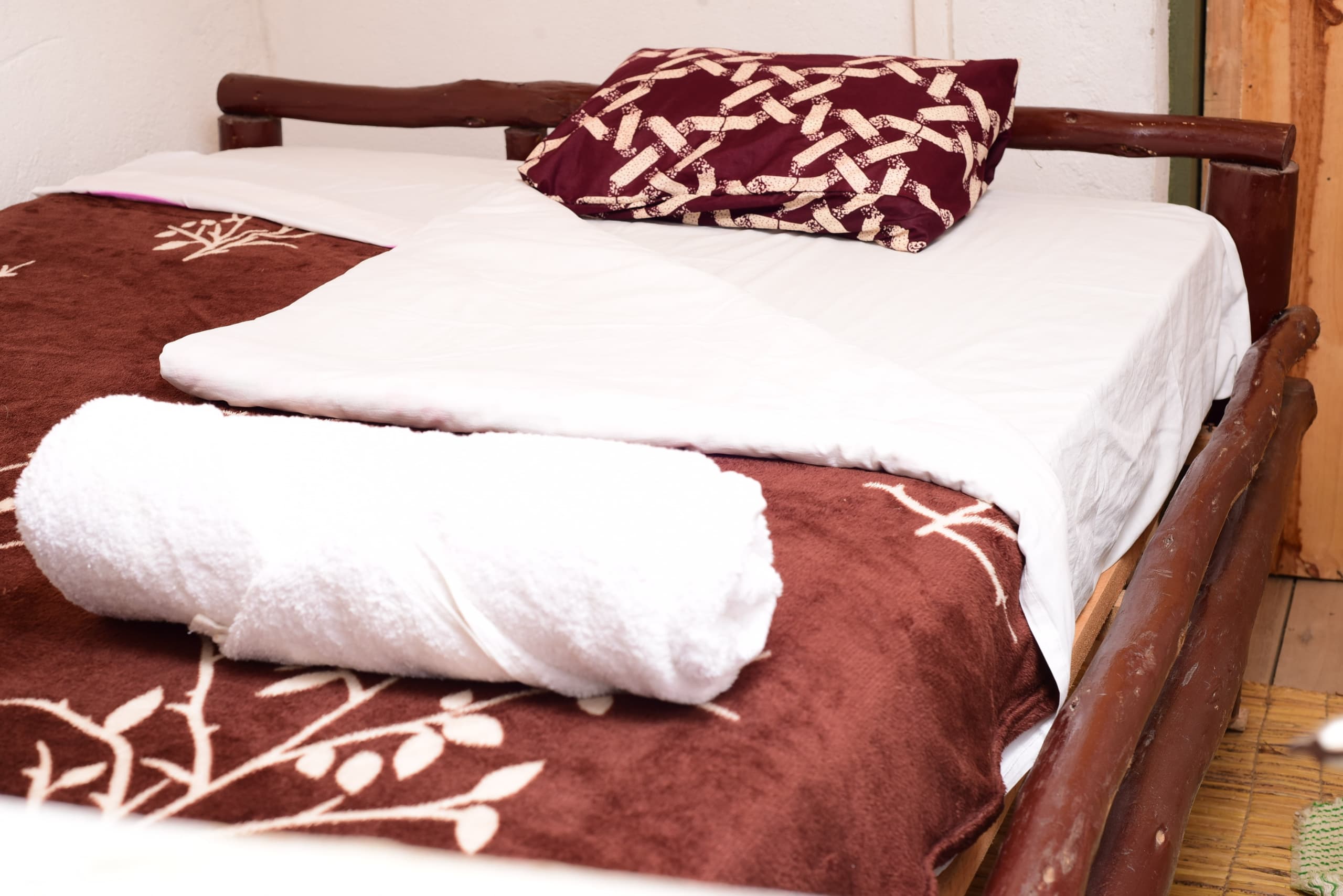 inside of a rwandan home with sofa and traditional decorations